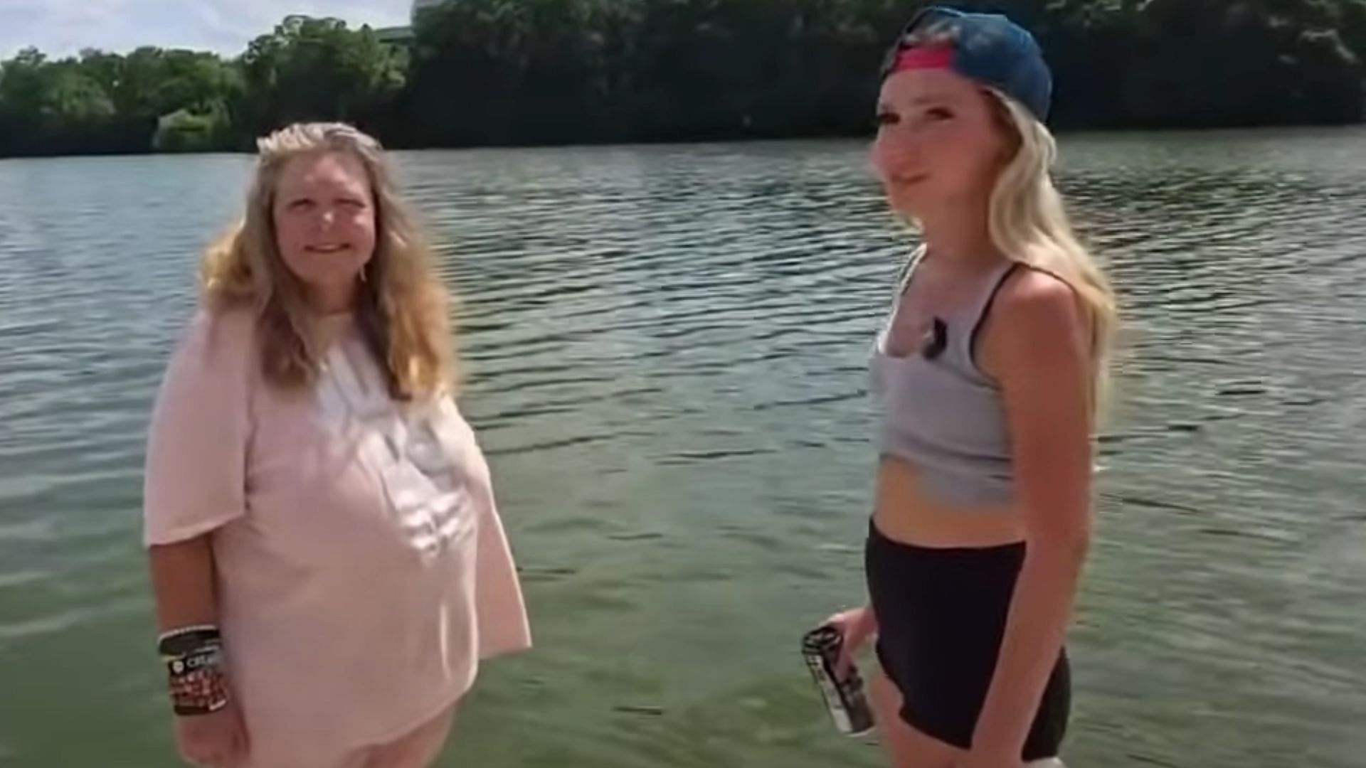 Natalie Reynolds (right) asking a woman to jump in a lake to find her scanner (Image via NatalieReynolds/Kick)
